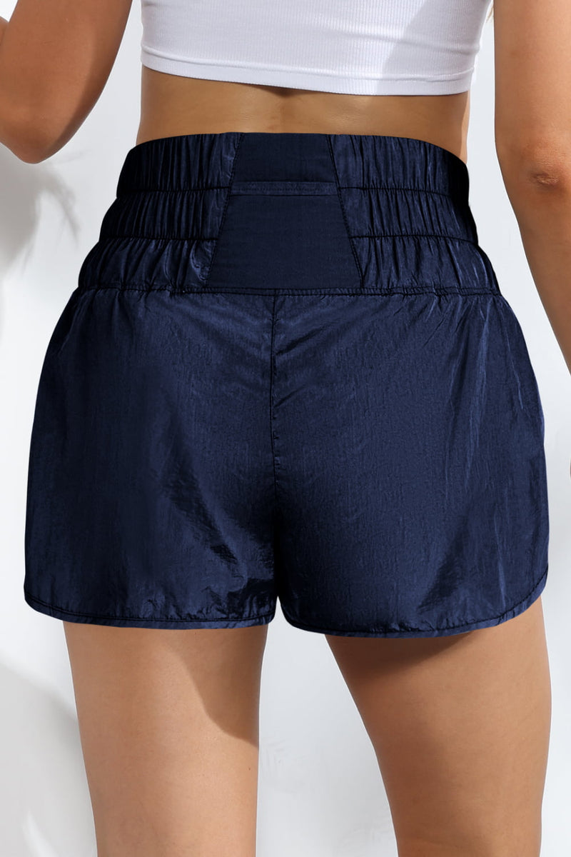 Shorts deportivos fruncidos transpirables