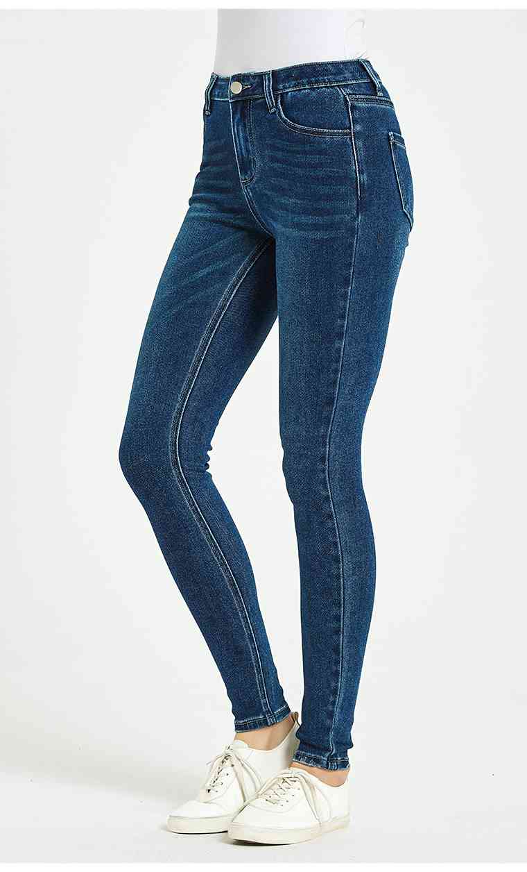 Jeans ajustados de talle medio y cintura de tamaño completo